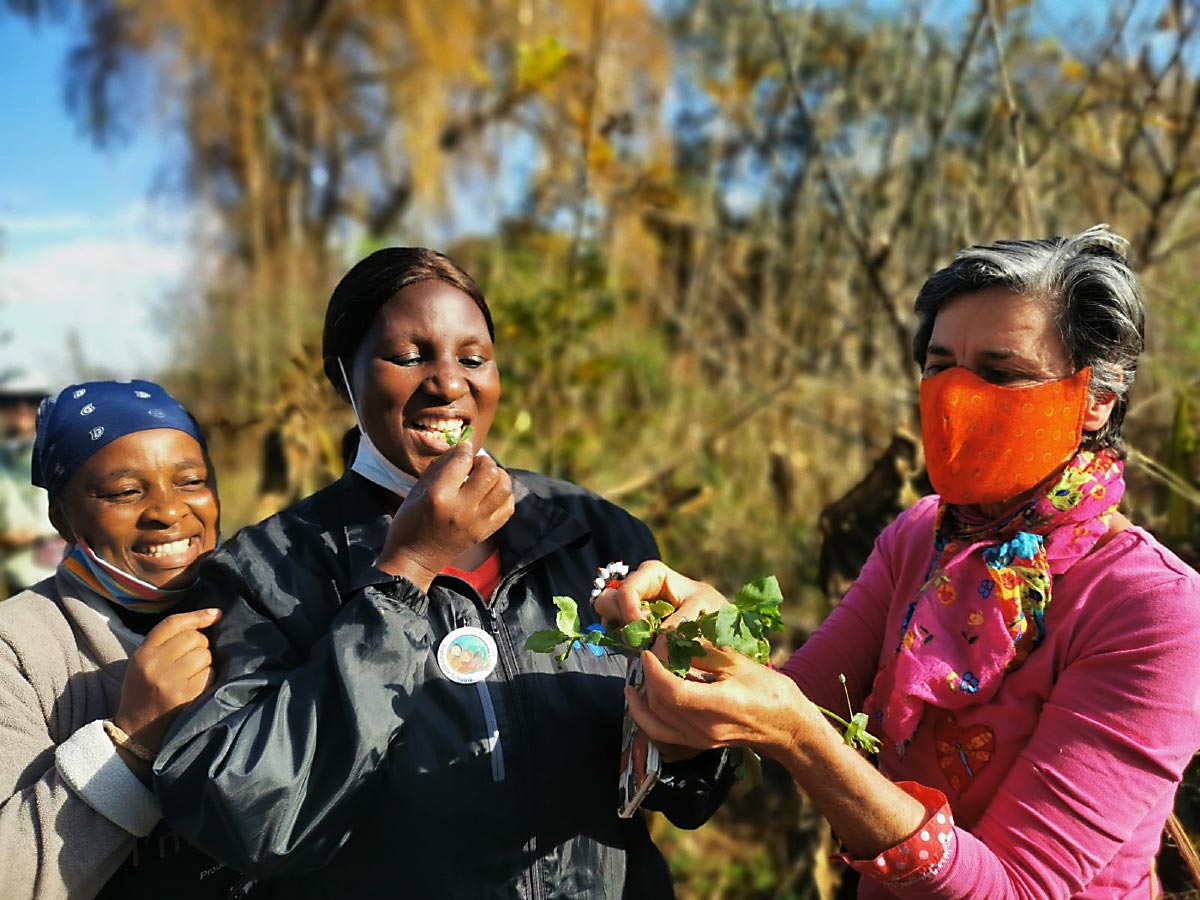ACT LOCAL: Nikki Brighton (right), locavore extraordinaire, shares her wealth of weedy knowledge with Thenjiwe Ngcobo and Antonia Mkhabela.