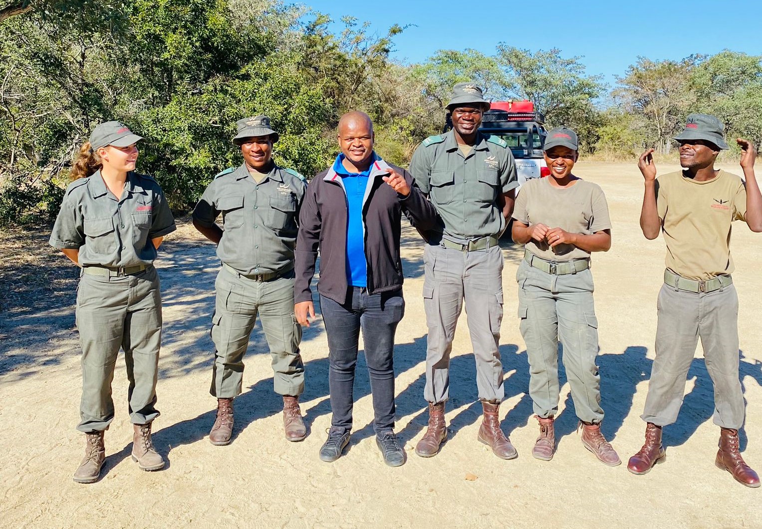 Dr Wiseman Ndlovu (third from left) in the Kruger National Park with a team of SanPark rangers from the K9 Anti-Poaching Unit. Photo: Supplied